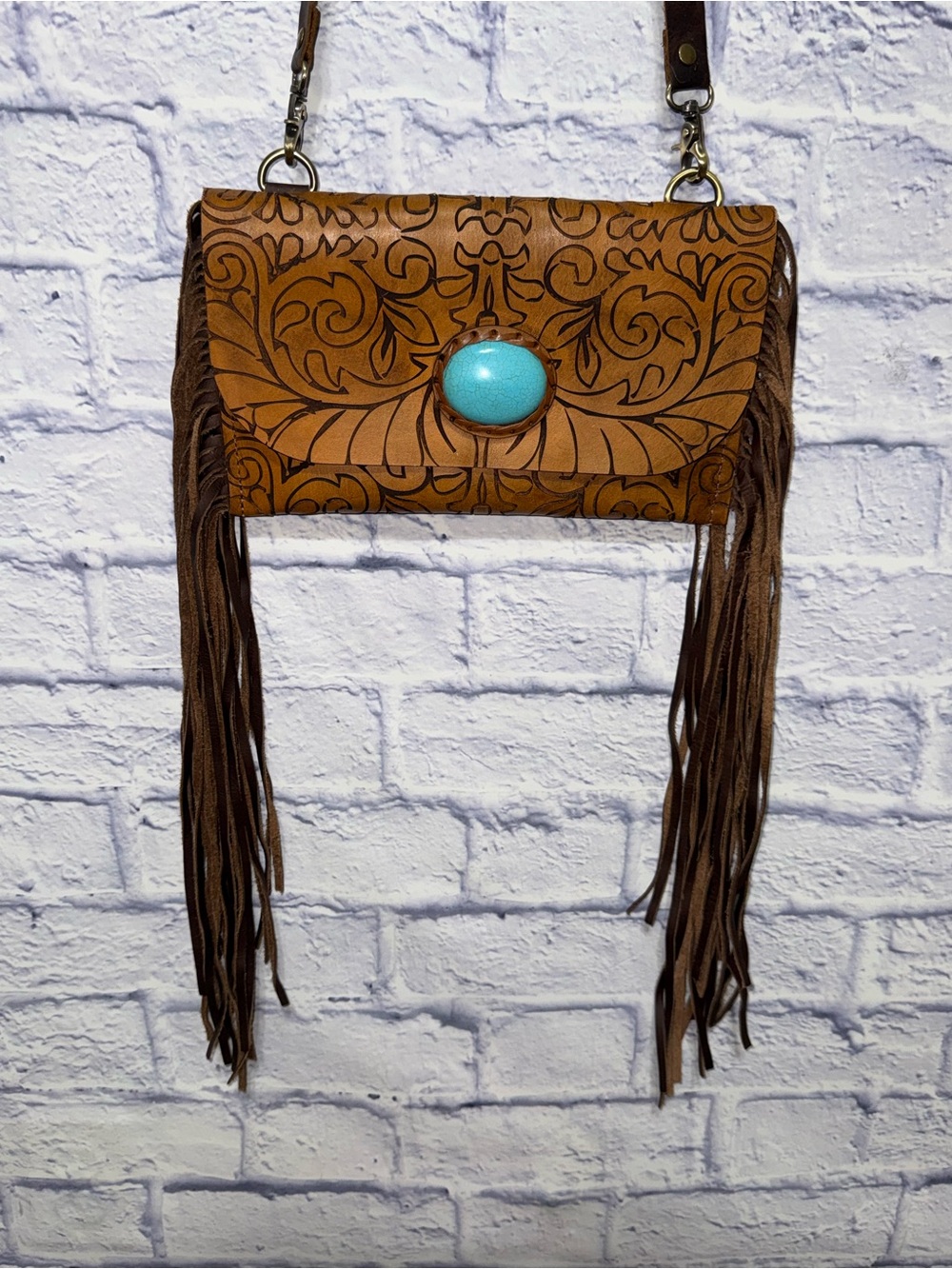 Western Tooled Leather Fringe Handbag

Make a statement with this stunning hand